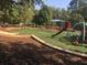 Community playground with swings and climbing features at 181 Dewy Rd # 70, Lilburn, GA 30047