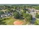 Residential area including houses, trees, a baseball field and streets at 2 N Broad St, Porterdale, GA 30070