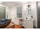 Modern bathroom with white shiplap, glass shower, and rustic wood accents at 2 N Broad St, Porterdale, GA 30070