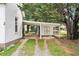 View of the property featuring a covered carport and storage shed at 2 N Broad St, Porterdale, GA 30070