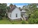 Charming exterior view of home, showing the front porch and well-maintained landscaping at 2 N Broad St, Porterdale, GA 30070