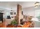Bright and airy living room featuring a striking brick fireplace and hardwood floors at 2 N Broad St, Porterdale, GA 30070
