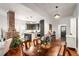 Spacious living room showcasing a brick fireplace, dining area, and open kitchen at 2 N Broad St, Porterdale, GA 30070