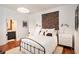Cozy main bedroom with white walls, hardwood floors, and stylish decor at 2 N Broad St, Porterdale, GA 30070