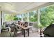 Relaxing covered porch featuring outdoor seating and dining area at 2 N Broad St, Porterdale, GA 30070