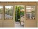 Backyard view from sunroom of patio set, lush landscaping, and surrounding greenery at 2366 Battle Forest Sw Dr, Marietta, GA 30064