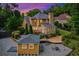Backyard featuring a deck, enclosed porch, outbuilding and gravel patio area at 2366 Battle Forest Sw Dr, Marietta, GA 30064