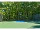 Outdoor basketball court surrounded by lush greenery at 2366 Battle Forest Sw Dr, Marietta, GA 30064