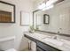 Stylish bathroom features granite counters and a large mirror at 2366 Battle Forest Sw Dr, Marietta, GA 30064