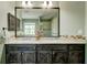 Bathroom featuring double sinks, granite countertops, and wooden cabinets at 2366 Battle Forest Sw Dr, Marietta, GA 30064