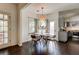 Cozy breakfast nook featuring hardwood floors, natural light, and adjacent kitchen at 2366 Battle Forest Sw Dr, Marietta, GA 30064