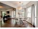Bright breakfast nook with hardwood floors, large window, and adjoining kitchen at 2366 Battle Forest Sw Dr, Marietta, GA 30064