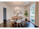 Elegant dining room featuring modern chandelier, hardwood floors and large window at 2366 Battle Forest Sw Dr, Marietta, GA 30064