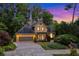 Charming stucco home with a lush landscaped yard and a two-car garage at 2366 Battle Forest Sw Dr, Marietta, GA 30064