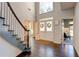 Open foyer featuring hardwood floors, staircase, double front doors and natural light at 2366 Battle Forest Sw Dr, Marietta, GA 30064