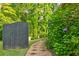 Beautiful landscaped yard features a stone walkway leading through the lush greenery, flowering plants, and a privacy fence at 2366 Battle Forest Sw Dr, Marietta, GA 30064