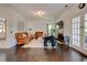 Cozy living room featuring hardwood floors, a fireplace, and tan leather sofas at 2366 Battle Forest Sw Dr, Marietta, GA 30064