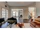 Open living space showcasing hardwood floors, fireplace, and access to the kitchen and dining area at 2366 Battle Forest Sw Dr, Marietta, GA 30064
