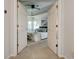 View through double doors of the main bedroom with a tray ceiling, bay window, and a king-size bed at 2366 Battle Forest Sw Dr, Marietta, GA 30064
