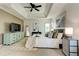 Spacious main bedroom features a ceiling fan, sitting area, and ensuite bathroom at 2366 Battle Forest Sw Dr, Marietta, GA 30064
