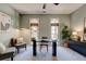 Well-lit home office featuring carpet, natural light, desk, and comfortable seating at 2366 Battle Forest Sw Dr, Marietta, GA 30064