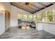 Bright sunroom with vaulted ceilings, plenty of windows, and stylish seating at 2366 Battle Forest Sw Dr, Marietta, GA 30064