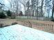 Backyard deck provides a relaxing place to enjoy the natural surroundings and wooded views at 6745 Fairfield Trce, Suwanee, GA 30024