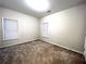 Neutral bedroom with two windows, carpeted floors, and calming ambiance, great for relaxation and rest at 6745 Fairfield Trce, Suwanee, GA 30024