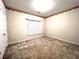 Bedroom has neutral walls, floral wallpaper and a large window that provides great natural light at 6745 Fairfield Trce, Suwanee, GA 30024