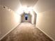Upstairs bonus room provides versatile space with carpet flooring and a dormer window at 6745 Fairfield Trce, Suwanee, GA 30024