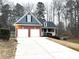 Inviting home with a two-car garage, brick facade, and manicured lawn, offering comfort and curb appeal at 6745 Fairfield Trce, Suwanee, GA 30024
