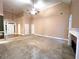 Bright and airy living room with a fireplace and seamless transition to dining area, great for entertaining at 6745 Fairfield Trce, Suwanee, GA 30024