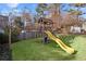 Backyard features a playset with slide, a lawn and a shed at 1495 Oak Springs Dr, Marietta, GA 30066