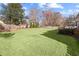 Expansive backyard with a well-maintained lawn and mature trees at 1495 Oak Springs Dr, Marietta, GA 30066
