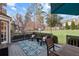 Outdoor deck features dining and lounge furniture, overlooking a large backyard at 1495 Oak Springs Dr, Marietta, GA 30066