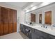 This bathroom features a large mirror, double sink vanity, and plenty of storage at 1495 Oak Springs Dr, Marietta, GA 30066