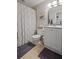 Well-lit bathroom boasts a shower with patterned curtain, and neutral vanity at 1495 Oak Springs Dr, Marietta, GA 30066