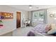 Cozy bedroom featuring natural light, a built-in desk, and calm, neutral decor at 1495 Oak Springs Dr, Marietta, GA 30066