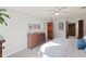 Bright bedroom features a light grey paint, carpet, and wooden dresser at 1495 Oak Springs Dr, Marietta, GA 30066
