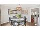 This dining room features hardwood floors, large mirror, and stylish light fixture at 1495 Oak Springs Dr, Marietta, GA 30066