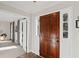 Inviting entryway featuring a wood door and leading into a sunlit living space at 1495 Oak Springs Dr, Marietta, GA 30066