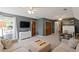 Spacious living room area with neutral decor, large tv, and seating at 1495 Oak Springs Dr, Marietta, GA 30066