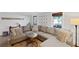 Cozy living room with a large sectional sofa, side table, and natural light at 1495 Oak Springs Dr, Marietta, GA 30066