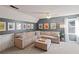 Inviting living room featuring a large sectional sofa and unique wall decor at 1495 Oak Springs Dr, Marietta, GA 30066