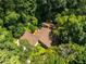 Aerial shot of the home nestled among lush, green trees at 1690 Trotters Ln, Stone Mountain, GA 30087