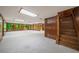 Spacious basement with ample natural light, wood paneling, carpet, and convenient staircase at 1690 Trotters Ln, Stone Mountain, GA 30087