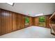 A paneled bonus room features wood accents and natural light from windows overlooking the wooded property at 1690 Trotters Ln, Stone Mountain, GA 30087