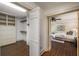 A spacious walk-in closet with custom shelving and storage, connected to the primary bedroom at 1690 Trotters Ln, Stone Mountain, GA 30087