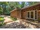 Stone facade featuring a wooden walkway, stained glass sidelights and stone patio at 1690 Trotters Ln, Stone Mountain, GA 30087