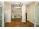 Foyer with herringbone brick floors, chandelier, and views of multiple rooms in the home at 1690 Trotters Ln, Stone Mountain, GA 30087